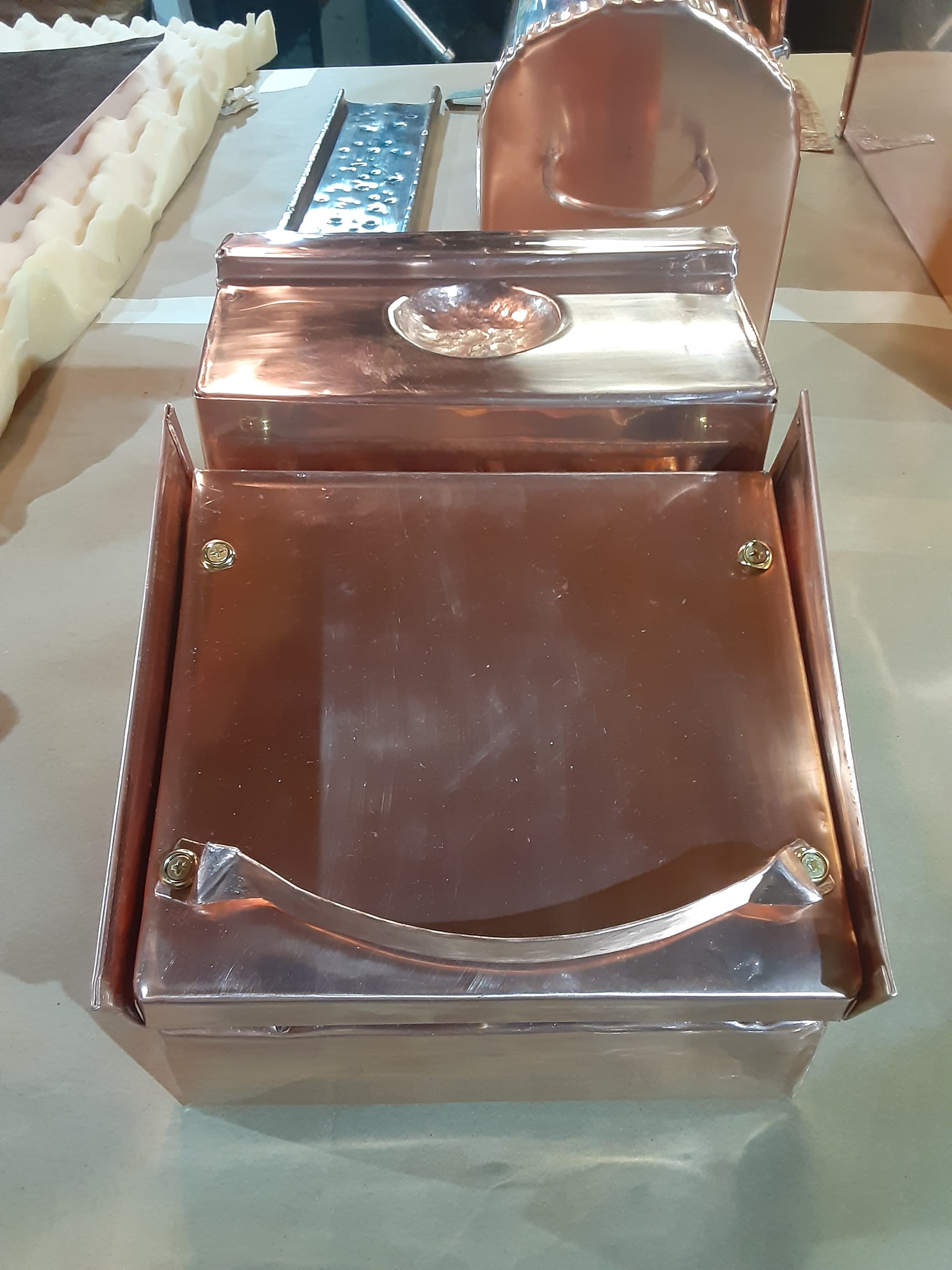 Hand-crafted copper urn with decorative medallion