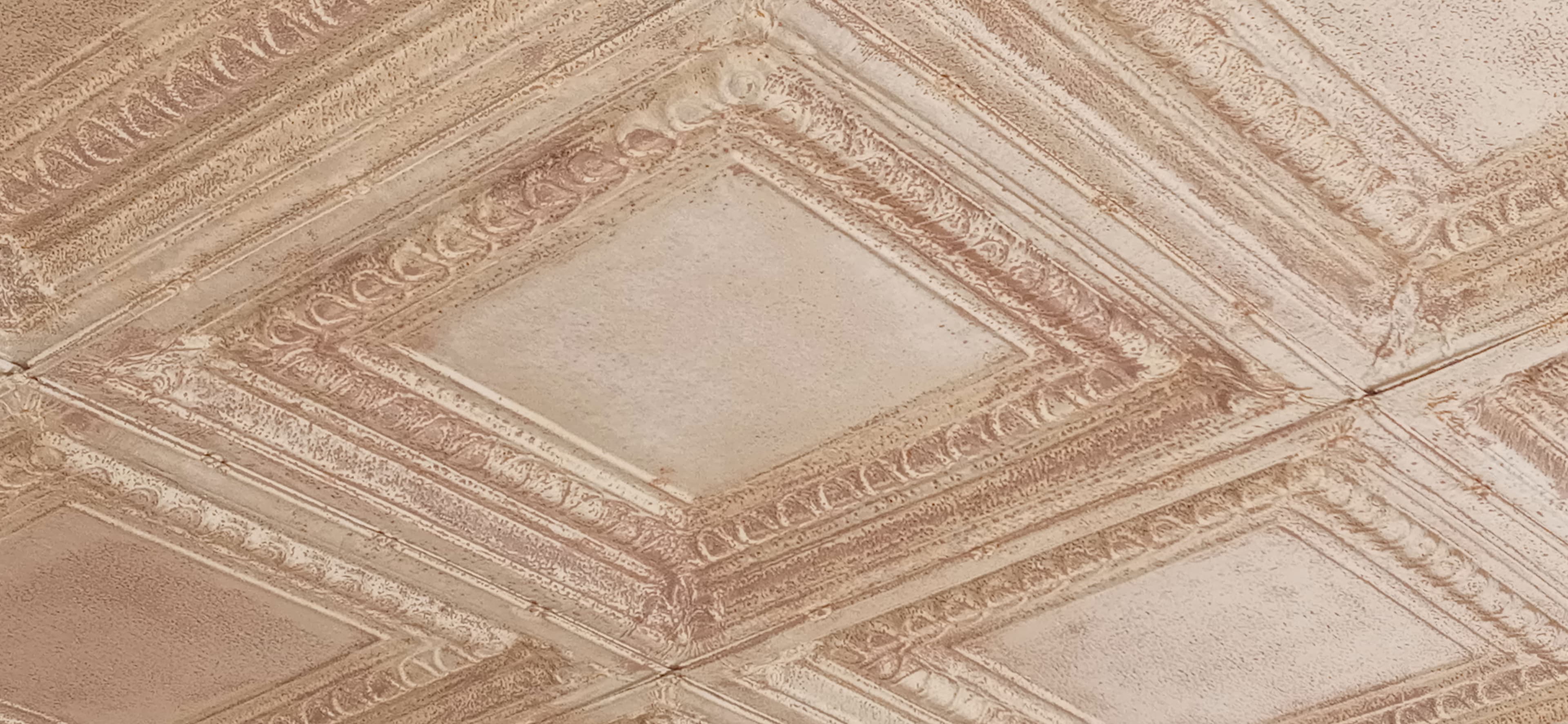 Copper stamped ceiling tiles with ornate pattern